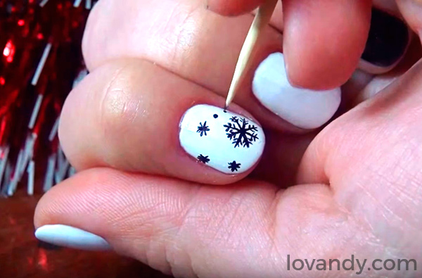 black snowflakes on white nails